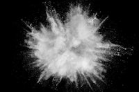 a white powder explosion on a black background